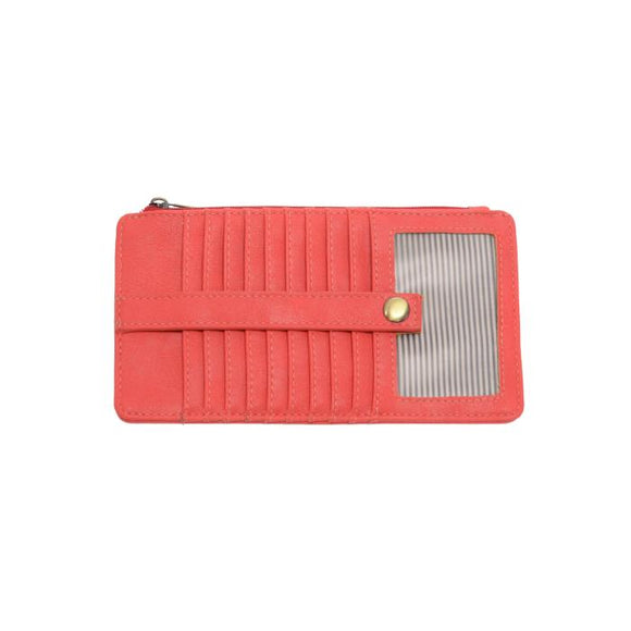 This slim and sleek wallet has nine credit card pockets, each with a snap tab for security and brass-plated hardware. It also has an ID window, zippered change pocket, and zippered billfold pocket in distressed beautiful sizzling red vegan leather.


DIMENSIONS: 3.75 IN. H X 7.25 IN. W X .25 IN. D 


100% Vegan leather (polyurethane)