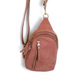 Our best-selling Skyler is now in soft luscious spice colored vegan suede, perfect for Fall. This organized sling brings a cozy vibe to your look and will look great layered over your favorite chunky sweater. With space for your large phone, keys, wallet, lip gloss and more, you will be able to carry everything you need with hands free convenience

Product Details
Dimensions: 8 in. H x 5.5 in. W x 2.25 in. D
Removable and adjustable convertible strap drop: 20-30 in.
Top zip closure
Exterior front zip pocket