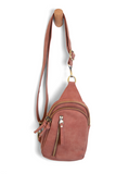 Our best-selling Skyler is now in soft luscious spice colored vegan suede, perfect for Fall. This organized sling brings a cozy vibe to your look and will look great layered over your favorite chunky sweater. With space for your large phone, keys, wallet, lip gloss and more, you will be able to carry everything you need with hands free convenience

Product Details
Dimensions: 8 in. H x 5.5 in. W x 2.25 in. D
Removable and adjustable convertible strap drop: 20-30 in.
Top zip closure
Exterior front zip pocket