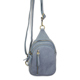 Blending uptown chic with downtown cool, the Skyler sling bag in dusty blue is made in pretty raspberry vegan leather! A convertible strap lends versatility, while a front zip pocket offers practical storage for your necessities. It is the perfect companion for a night out on the town or a fun day trip!


8" h x 5.5" w&nbsp; x 2.25" d
Removable and adjustable convertible strap 20"-30" drop
Zippered top closure
Exterior front zip pocket
2 exterior zip compartments
4 interior credit card pockets
Brass plated 