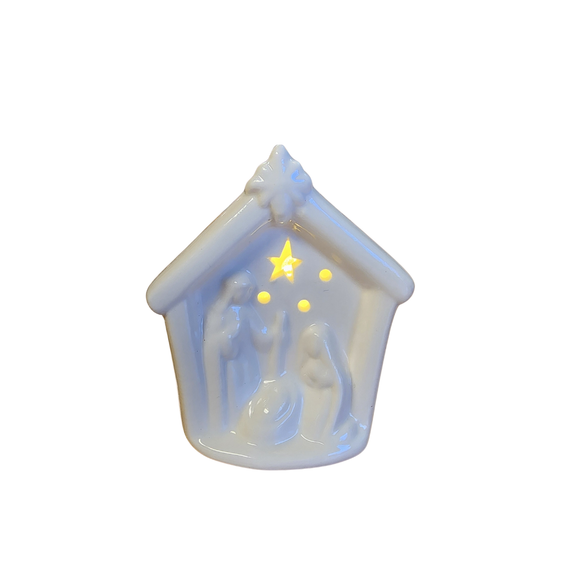 This sweet small white ceramic nativity has a beautiful scene of the holy family with one star and three circle cutouts above them that lights up when you turn the switch on the bottom on. A perfect little reminder of the reason for the season!

3.25