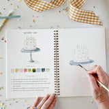 An invitation to slow down and paint something pretty. The Celebrate Watercolor Workbook features twelve party illustrations — balloons, a wrapped gift, a confetti birthday cake, a pup in a party hat, and more — each outlined and ready to paint. Simple step-by-step instructions walk you through every illustration, and most paintings take about thirty minutes from start to finish — so even if you've never painted before, you'll have something lovely in your hands by the end. A sweet birthday gift, or an easy