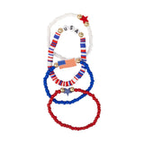 Show your patriotic spirit in style with this vibrant Stars &amp; Stripes bracelet set, featuring four unique Americana-inspired designs crafted with colorful acrylic beads and gold accents. Perfect for Fourth of July, Memorial Day, or any summer gathering, these cheerful bracelets add a festive finishing touch to your party look and make celebrating with friends even more memorable.

You'll receive four 6" bracelets:

Red, white &amp; blue beaded bracelet with "USA" beads with two gold beads on either side