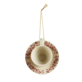 Bring a touch of whimsical elegance this Christmas with the Stoneware Teacup Ornament with Botanical Motif in cream and burgundy. Thoughtfully handcrafted with artful botanical details, a natural glaze, and texture variations.

1.5" H x 3.5" W (includes handle) x 3" D