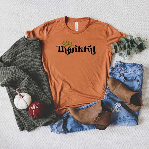 Every day is a great day to be thankful! This beautiful orange marmalade-colored tee is oh-so-soft, so much so that you'll never want to take it off! The word 