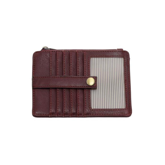 We love this mini wallet in a blackberry colored vegan leather! It is full of style and will hold your license and up to six credit cards. The zipper pocket is roomy enough for your change and cash, and a pocket is on the back.  This mini wallet is perfect for you, but it makes an awesome gift!

DIMENSIONS: 4 IN. H X 5.5 IN. W X .25 IN. D

ZIPPERED TOP CLOSURE ON EDGE

6 CREDIT CARD POCKETS

ID WINDOW POCKET

EXTERIOR PASSPORT POCKET

STRIPED LINING

BRASS PLATED HARDWARE

100% VEGAN LEATHER (POLYURETH