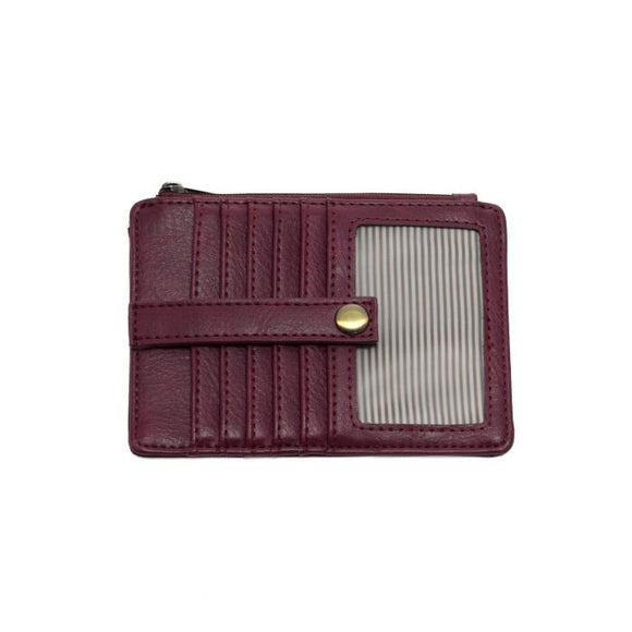 We love this mini wallet in a blackberry colored vegan leather! It is full of style and will hold your license and up to six credit cards. The zipper pocket is roomy enough for your change and cash, and a pocket is on the back.  This mini wallet is perfect for you, but it makes an awesome gift!

DIMENSIONS: 4 IN. H X 5.5 IN. W X .25 IN. D

ZIPPERED TOP CLOSURE ON EDGE

6 CREDIT CARD POCKETS

ID WINDOW POCKET

EXTERIOR PASSPORT POCKET

STRIPED LINING

BRASS PLATED HARDWARE

100% VEGAN LEATHER (POLYURETH