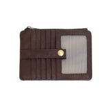 We love this mini wallet in a rich umber vegan leather! It is full of style and will hold your license and up to six credit cards. The zipper pocket is roomy enough for your change and cash, and a pocket is on the back.&nbsp; This mini wallet is perfect for you, but it makes an awesome gift!

DIMENSIONS: 4 IN. H X 5.5 IN. W X .25 IN. D

ZIPPERED TOP CLOSURE ON EDGE

6 CREDIT CARD POCKETS

ID WINDOW POCKET

EXTERIOR PASSPORT POCKET

STRIPED LINING

BRASS PLATED HARDWARE

100% VEGAN LEATHER (POLYURETHANE)