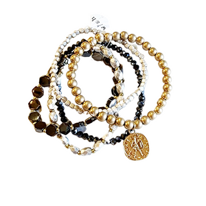 You'll love this five-piece stretch Boho Beaded Bracelet Stack! It features a gorgeous combination of told metal, white/gold-toned glass beads, and a worn gold-toned coin. It's perfect for any season and great to combine with other bracelets for a thicker bracelet stack!  Stretchy bracelet, one size fits most.