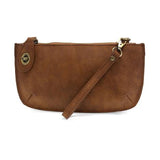 Our bestselling crossbody turn lock clutch has been re-imagined in soft, vegan suede leather in walnut. Sleek and versatile with removable straps, this style can be worn as a Crossbody, carried as a wristlet or a clutch, even doubles as a wallet! With interior credit card slots and enough space to carry your phone, sunglasses, and any other must-haves, all held securely by our locking closure. This casual style is destined to become your new go-to favorite all year long.
Product Details
Dimensions: 5 in. H 