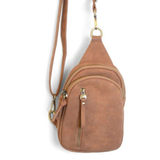 Our best-selling Skyler is now in soft luscious walnut colored vegan suede, perfect for Fall. This organized sling brings a cozy vibe to your look and will look great layered over your favorite chunky sweater. With space for your large phone, keys, wallet, lip gloss and more, you will be able to carry everything you need with hands free convenience


Product Details
Dimensions: 8 in. H x 5.5 in. W x 2.25 in. D
Removable and adjustable convertible strap drop: 20-30 in.
Top zip closure
Exterior front zip pock