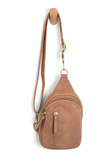 Our best-selling Skyler is now in soft luscious walnut colored vegan suede, perfect for Fall. This organized sling brings a cozy vibe to your look and will look great layered over your favorite chunky sweater. With space for your large phone, keys, wallet, lip gloss and more, you will be able to carry everything you need with hands free convenience


Product Details
Dimensions: 8 in. H x 5.5 in. W x 2.25 in. D
Removable and adjustable convertible strap drop: 20-30 in.
Top zip closure
Exterior front zip pock
