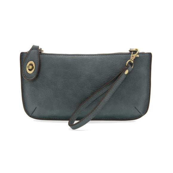 Our most popular bag, this mini clutch, with its sleek silhouette, is as gorgeous as it is versatile.  Features include a polished turn lock, six card slots, and an interior zipper for change.  It can be styled in many ways, with removable straps to alternate between wallet, crossbody, and wristlet!   5