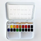 Everything you need to start painting, gathered in one compact tin. This set pairs beautifully with the Emily Lex Studio watercolor workbooks and paintable notecards. The 18 colors look beautiful straight from the palette and also mix wonderfully into your own colors.

The fold-open tin holds your paints, mixing trays, and a petite size 6 round brush. Lightweight and travel-ready, it tucks easily into a bag so you can paint wherever the mood strikes.

Details: - 18 watercolors in a range of hues for easy mi