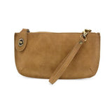 Our bestselling crossbody turn lock clutch has been re-imagined in soft, vegan suede leather in wheat. Sleek and versatile with removable straps, this style can be worn as a Crossbody, carried as a wristlet or a clutch, even doubles as a wallet! With interior credit card slots and enough space to carry your phone, sunglasses, and any other must-haves, all held securely by our locking closure. This casual style is destined to become your new go-to favorite all year long.
Product Details
Dimensions: 5 in. H x