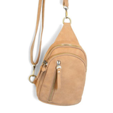 Our best-selling Skyler is now in soft luscious wheat colored vegan suede, perfect for Fall. This organized sling brings a cozy vibe to your look and will look great layered over your favorite chunky sweater. With space for your large phone, keys, wallet, lip gloss and more, you will be able to carry everything you need with hands free convenience


Product Details
Dimensions: 8 in. H x 5.5 in. W x 2.25 in. D
Removable and adjustable convertible strap drop: 20-30 in.
Top zip closure
Exterior front zip pocke