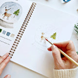 The Winter Watercolor Workbook includes 12 winter-themed illustrations with an example of the finished painting, step-by-step instructions, and a lightly illustrated sketch for you to paint. It's just like a coloring book, but with watercolor! Enjoy this peaceful painting hobby on your own, with children, or with friends. Makes a wonderful gift and is perfect for artists of any age.

12 beginner-friendly illustrations on thick 120lb watercolor paper

Lay-flat pages with spiral binding for hassle-free painti