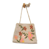 Lovely hand embroidered flowers in multiple colors of pink, peach and green adorn this sweet crossbody style crafted in all-natural jute. Just the right size to stow a large wallet, phone and more. This bag will look perfect with your sundress or shorts this summer!

Dimensions: 10.5 in. H x 11.5 in. W x 4 in. D
Magnetic snap closure
Shoulder strap: 21 in. drop
Brass plated hardware
100% Natural Jute with embroidered flowers
Unlined