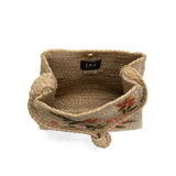 Lovely hand embroidered flowers in multiple colors of pink, peach and green adorn this sweet crossbody style crafted in all-natural jute. Just the right size to stow a large wallet, phone and more. This bag will look perfect with your sundress or shorts this summer!

Dimensions: 10.5 in. H x 11.5 in. W x 4 in. D
Magnetic snap closure
Shoulder strap: 21 in. drop
Brass plated hardware
100% Natural Jute with embroidered flowers
Unlined