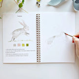The Animals Watercolor Workbook includes 12 animal illustrations with an example of the finished painting, step-by-step instructions, and a lightly illustrated sketch for you to paint. It's just like a coloring book, but with watercolor!&nbsp;Enjoy this peaceful painting hobby on your own, with children, or with friends. Makes a wonderful gift and is perfect for artists of any age.

12 beginner-friendly illustrations on thick 120lb watercolor paper

Lay-flat pages with spiral binding for hassle-free paintin