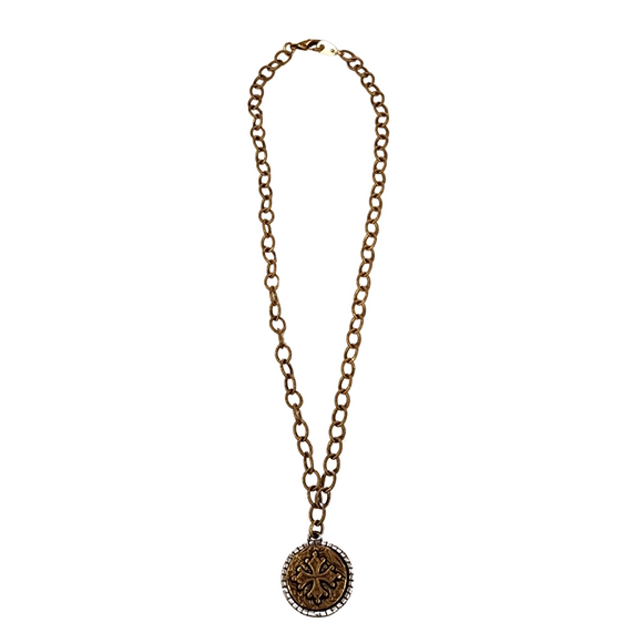 Add some unexpected charm to your jewelry collection with the Adelaide Necklace. This playful two tone coin necklace is sure to catch the eye and add a touch of whimsy to any outfit. 16