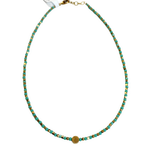 This choker is so pretty and will look great layered or worn alone!&nbsp; Brass and&nbsp;multi-colored grey faceted beads alternate and meet in the center will a circular brass bead for a fun detail!&nbsp; There is a lobster clasp closure with room to adjust the size of the necklace from&nbsp;14.5" - 15"&nbsp;&nbsp;

Handmade by a young designer and team of artists in Northern India