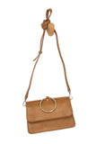 Put a ring on it! Perfect for your next night out, this cute scotch bracelet bag looks great with your fav jeans or slinky dress! With multiple compartments, it is just the right size to hold all your essentials. Wear it on your wrist with the metallic ring bracelet, or carry as a clutch, or wear as a crossbody with the detachable shoulder strap.


Dimensions: 6 in. H x 8.25 in. W x 3.5 in. at deepest point
Tapers up to the top point
Adjustable and removable crossbody strap: 20-25 in.
3 in. diameter ring th