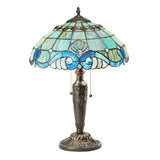 Bring the timeless grandeur of the European Baroque era to you home with this gorgeous Baroque Stained Glass Table Lamp! This lamp makes a statement with it hand-assembled glasswork. The domed shade features an impressive blend of 201 individual pieces of rippled and striated glass and 30 luminous, glowing cabochons. When illuminated, the textured glass panels filter the light beautifully, projecting a soft, comforting ambient glow outward to scatter an inviting warmth across your surfaces. It has a durable