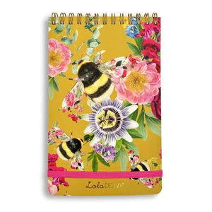 If you like taking notes like we do, you'll love our new reporter-style top spiral notepads!  This mustard cover has three bees in the center surrounded by pink, purple, red, blue, and yellow flowers.  We love that it has a pink elastic closure below to keep everything together!  150 Pages.  Approximately 4.5"W x 7.25"H