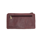 This slim and sleek wallet has nine credit card pockets, each with a snap tab for security and brass-plated hardware. It also has an ID window, zippered change pocket, and zippered billfold pocket in distressed currant vegan leather.


DIMENSIONS: 3.75 IN. H X 7.25 IN. W X .25 IN. D&nbsp;


100% Vegan leather (polyurethane)