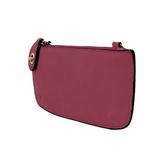 Our most popular bag, in a beautiful mulberry, this mini clutch, with its sleek silhouette, is as gorgeous as it is versatile.&nbsp; Features include a polished turn lock, six card slots, and an interior zipper for change.&nbsp; It can be styled in many ways, with removable straps for alternating between wallet, crossbody, and wristlet!

&nbsp;5"H x 9.5"W x 1"D

Removable and adjustable crossbody strap 13"-24"

Wristlet strap 7" long

interior zippered pocket

brass plated hardware

100% vegan leather (poly