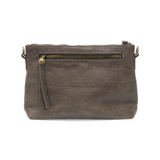 This sleek top zip clutch crafted in a taupe colored buffalo grain vegan leather is accented with whipstitching to give it a modern western style. It looks great with jeans or a dress and easily goes from day to night as the Oakley can be carried as a clutch, a wristlet or a crossbody bag with the included detachable wristlet strap with whipstitched details, an adjustable and removable shoulder strap.


Dimensions: 7 in. H x 10 in. W x 3 in. D
Top zip closure
Wristlet strap with whipstitching: 8 in. long
Ad