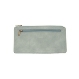 This slim and sleek wallet has nine credit card pockets, each with a snap tab for security and brass-plated hardware. It also has an ID window, zippered change pocket, and zippered billfold pocket in distressed bluebird skies vegan leather.


DIMENSIONS: 3.75 IN. H X 7.25 IN. W X .25 IN. D&nbsp;


100% Vegan leather (polyurethane)