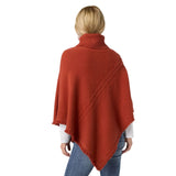 The epitome of cozy, this everyday luxury poncho is crafted from a soft knit fabric in spice, with a rich cable texture that adds depth and dimension. Designed with a relaxed drape and a comfortable turtleneck, it delivers effortless warmth while maintaining an elevated, easy silhouette. The lightweight feel allows for comfortable layering without bulk, making it a versatile piece for both casual and polished styling. Soft. Luxe. and made for all day comfort, this poncho brings refined ease and timeless app