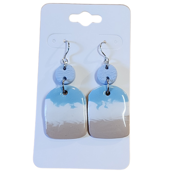 You will love these lightweight, trendy polymer clay earrings in a fun beachy, coastal style with a rectangle shape in blue, white and sand. This pair of clay earrings is coated with a resin layer to give them a pretty shine and finished look! The earring hooks are comfortable and easy to wear and made of high-quality, strong/durable stainless steel, which is hypoallergenic and nickel-free. * 

This versatile earring design would accompany any outfit, from casual to dressed up! 

Handcrafted in Te