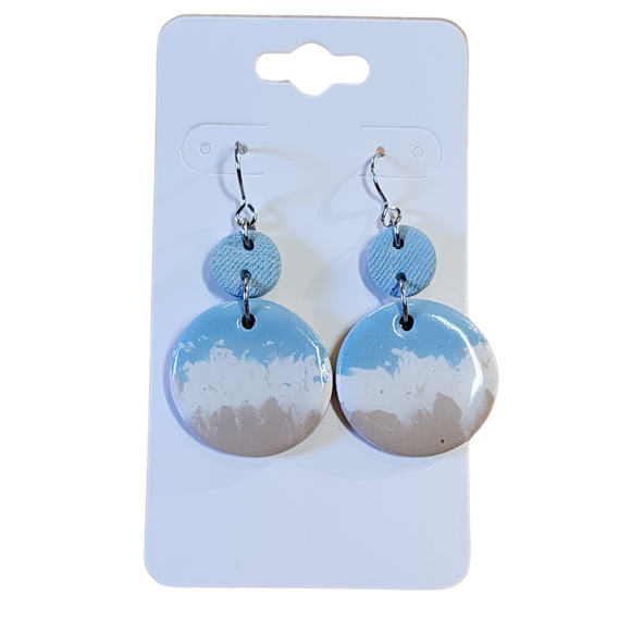 You will love these lightweight, trendy polymer clay earrings in a fun beachy, coastal style with a circle shape in blue, white and sand. This pair of clay earrings is coated with a resin layer to give them a pretty shine and finished look! The earring hooks are comfortable and easy to wear and made of high-quality, strong/durable stainless steel, which is hypoallergenic and nickel-free. * 

This versatile earring design would accompany any outfit, from casual to dressed up! 

Handcrafted in Texas