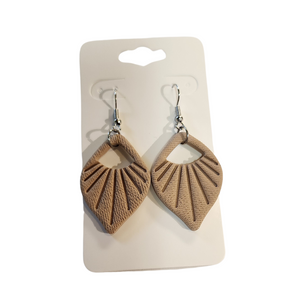 You will love these lightweight, trendy polymer clay earrings with a beautiful shell pattern in sand This pair of clay earrings is coated with a resin layer to give them a pretty shine and finished look! The earring hooks are comfortable and easy to wear and made of high-quality, strong/durable stainless steel, which is hypoallergenic and nickel-free. *&nbsp;

This versatile earring design would accompany any outfit, from casual to dressed up!&nbsp;

Handcrafted in Texas, USA&nbsp;

CARE INSTRUCTIONS FOR EA