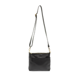 Your perfect goes with anything bag! In just the right size to carry your essentials, this pebbled vegan black leather bag has multiple pockets and a top zip closure for security, so you are ready for anything your day brings. Add one of our interchangeable Guitar Straps to add your own style!

Product Details
Dimensions: 11 in. W x 11.25 in. H x 3.5 in. D
Magnetic Snap Closure
2 Open and 1 Zipper Interior Pockets
2 Exterior Open Pockets and 1 Back Zipper Pocket
12x18 in. Drop Adjustable and Detachable Cros