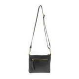 Your perfect goes with anything bag! In just the right size to carry your essentials, this pebbled vegan black leather bag has multiple pockets and a top zip closure for security, so you are ready for anything your day brings. Add one of our interchangeable Guitar Straps to add your own style!

Product Details
Dimensions: 11 in. W x 11.25 in. H x 3.5 in. D
Magnetic Snap Closure
2 Open and 1 Zipper Interior Pockets
2 Exterior Open Pockets and 1 Back Zipper Pocket
12x18 in. Drop Adjustable and Detachable Cros