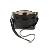 Your perfect goes with anything bag! In just the right size to carry your essentials, this pebbled vegan black leather bag has multiple pockets and a top zip closure for security, so you are ready for anything your day brings. Add one of our interchangeable Guitar Straps to add your own style!

Product Details
Dimensions: 11 in. W x 11.25 in. H x 3.5 in. D
Magnetic Snap Closure
2 Open and 1 Zipper Interior Pockets
2 Exterior Open Pockets and 1 Back Zipper Pocket
12x18 in. Drop Adjustable and Detachable Cros