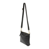 Your perfect goes with anything bag! In just the right size to carry your essentials, this pebbled vegan black leather bag has multiple pockets and a top zip closure for security, so you are ready for anything your day brings. Add one of our interchangeable Guitar Straps to add your own style!

Product Details
Dimensions: 11 in. W x 11.25 in. H x 3.5 in. D
Magnetic Snap Closure
2 Open and 1 Zipper Interior Pockets
2 Exterior Open Pockets and 1 Back Zipper Pocket
12x18 in. Drop Adjustable and Detachable Cros