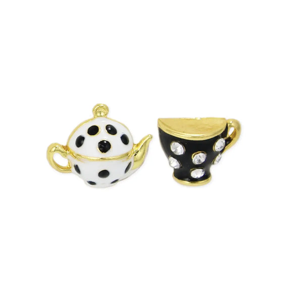 Care for a SPOT of tea?  You'll get compliments on these playful black and white teapot and teacup post earrings. They are a whimsical, and charming, mismatched pair that celebrates the joy of tea time. They feature a white with black polka dot teapot and a black rhinestone-covered teacup. The intricate detailing and contrasting colors create a playful and eye-catching look. Celebrate the whimsy and nostalgia of tea time with this delightful teapot and teacup earring set, perfect for those who apprecia