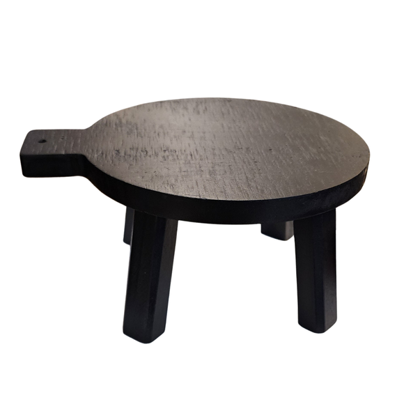 This distressed black wooden stool is perfect for setting a plant, small lamp, or cute vignette on!  If you need to give something some height to your decor, this little stool will help you do just that!

Round top.  4.5