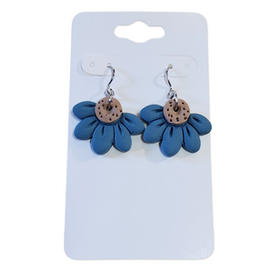 You will love these lightweight, trendy polymer clay daisy earrings that are the cutest! This one has five smooth petals in blue with earring hooks are comfortable and easy to wear and made of high-quality, strong/durable stainless steel, which is hypoallergenic and nickel-free. *&nbsp;

This versatile earring design would accompany any outfit, from casual to dressed up!&nbsp;

Handcrafted in Texas, USA&nbsp;

CARE INSTRUCTIONS FOR EARRINGS * Store in a clean, dry place. * To clean: rub gently with a soft c