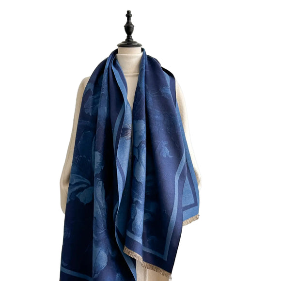 Blue scarf with floral pattern on a mannequin against a white background