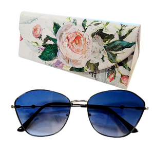 These frames feature gradient blue lenses that provide both style and sun protection. The accompanying collapsible floral printed case adds a touch of convenience and charm. Whether lounging on the beach or strolling through the city, these sunglasses are the perfect way to add color and style to your look.
It comes with a coordinating triangle-shaped case with a floral design
Gradient Lens
100% UV protection


sunglasses: 5 1/2"W x 2"L x 1"H


case: 6 1/2" W x 3" L x 2" H