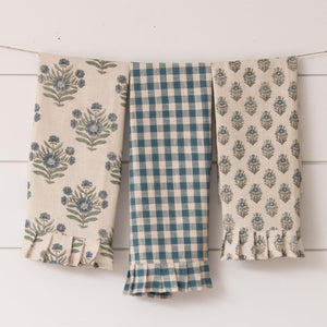 These blue floral and checked printed trio of towels will make your kitchen happy!  There is one blue and off-white gingham checked towel, one large block print blue and green floral towel, and a small block print in blue and green in this set.  The best part? The RUFFLES at the bottom of each towel!!  27" H x 17" W  Cotton