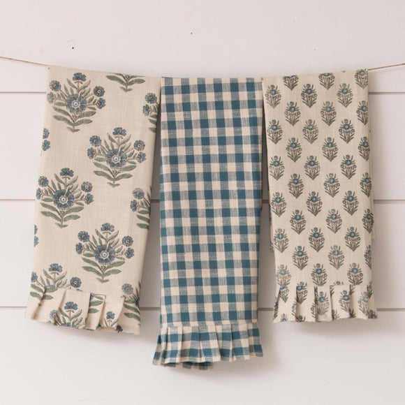 These blue floral and checked printed trio of towels will make your kitchen happy!  There is one blue and off-white gingham checked towel, one large block print blue and green floral towel, and a small block print in blue and green in this set.  The best part? The RUFFLES at the bottom of each towel!!  27