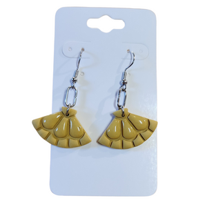 You will love these lightweight, trendy polymer clay earrings in a fun fan shaped mosaic pattern in beautiful yellow color. This pair of clay earrings is coated with a resin layer to give them a pretty shine and finished look! The earring hooks are comfortable and easy to wear and made of high-quality, strong/durable stainless steel, which is hypoallergenic and nickel-free. *&nbsp;

This versatile earring design would accompany any outfit, from casual to dressed up!&nbsp;

Handcrafted in Texas, USA&nbsp;

C