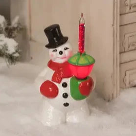 Bring back the nostalgia and memories of holidays gone by with this 1950s vintage-inspired bubble light snowman! It is made of hand-glazed resin, electrically wired glass bubble light, and glitter accents. The snowman includes a light. 

Materials: Glazed resin. Electrically wired bubble light. Includes light. This item plugs into any US outlets.

Dimensions: 8.5